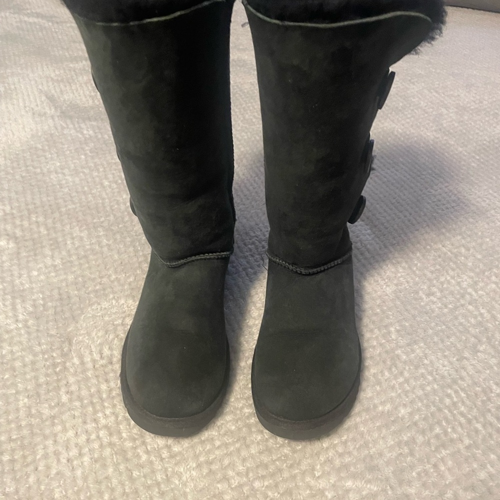 UGG fake fur lined with buttons. Worn only  once . Like new.